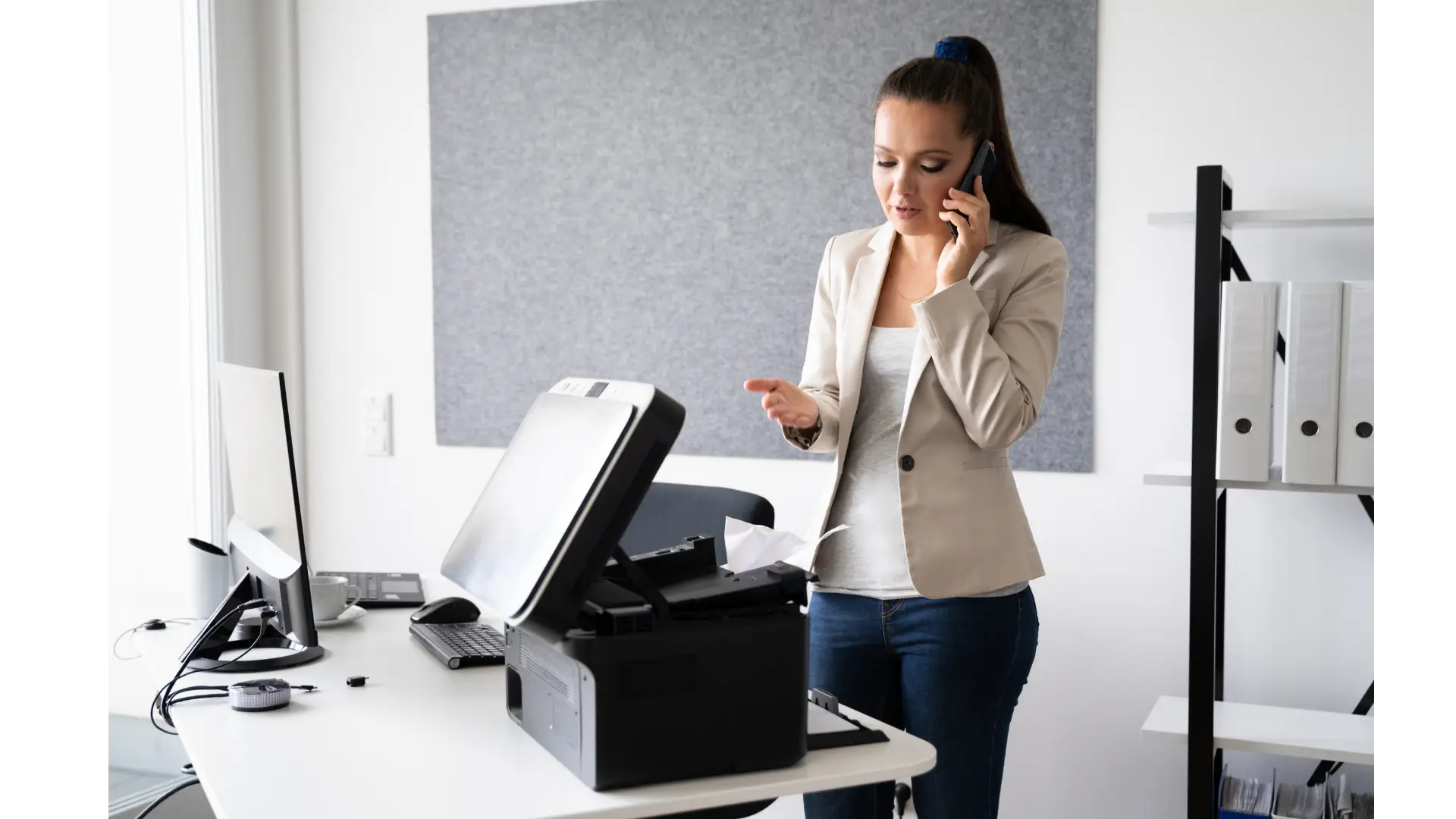 Office worker troubleshooting a printer with a printing error