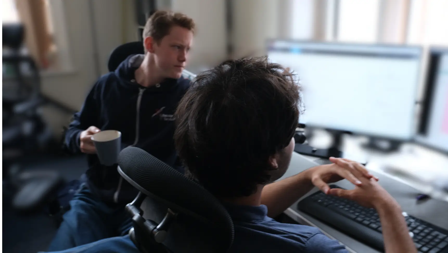 IT engineers collaborating to resolve a customer support ticket